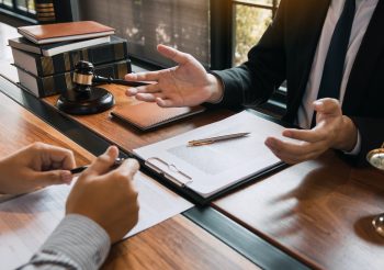 Lawyer is providing information about the client's trial at the lawyer office.